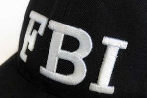 Image of an FBI Hat, courtesy of roberto_machado_noalightrocket (Getty Images).