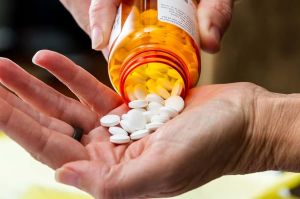 pills in someone's hands