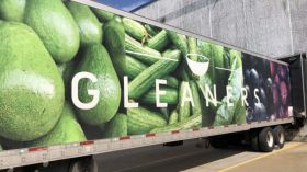 Gleaners semi with green vegetables on the side.