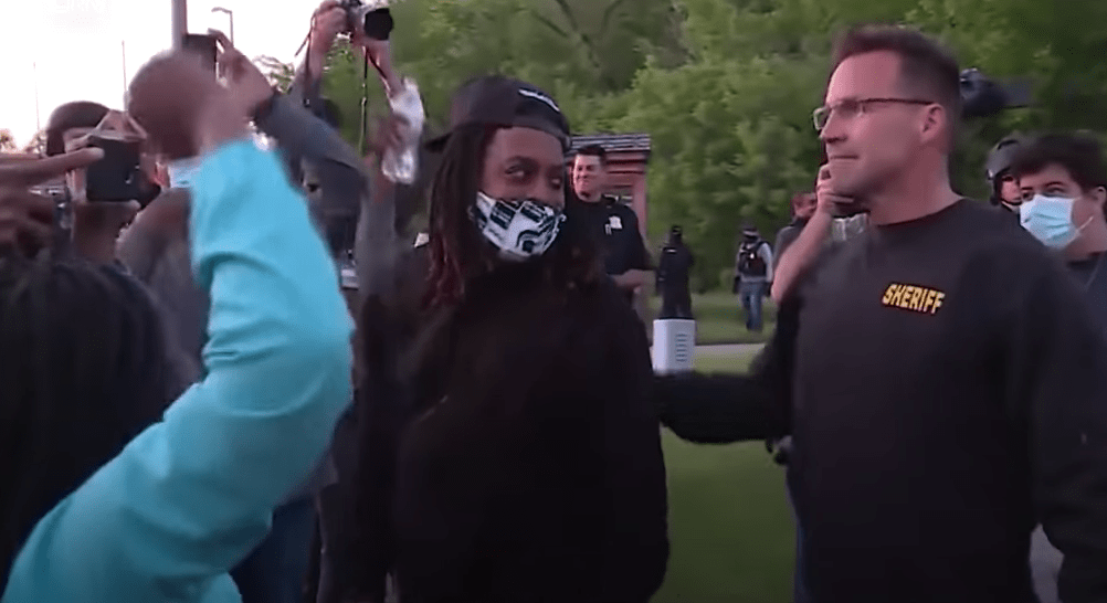 Michigan Sheriff Drops Baton, Joins Protestors in Solidarity WIBC 93.1 FM