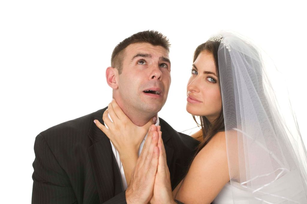 "close up of fighting married couple as a unhappy wedding concept, isolated on white background"