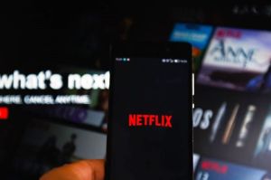 A photo of a Netflix logo on a phone
