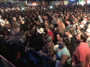 Large crowd at a concert inside 8 Seconds Saloon