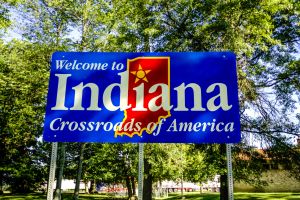 I-70 Welcome Center, Indiana, USA - July 5, 2006: Welcome to Indiana State Signpost surrounded by rich foliage in this heartland state