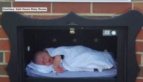 An infant inside a Safe Haven Baby Box.