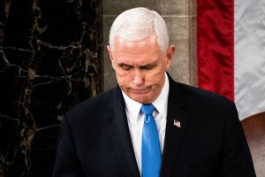 U.S. Vice President Mike Pence presides over a joint session of Congress to certify the 2020 Electoral College results on January 6, 2021 in Washington, DC. Congress held a joint session today to ratify President-elect Joe Biden's 306-232 Electoral College win over President Donald Trump. A group of Republican senators said they would reject the Electoral College votes of several states unless Congress appointed a commission to audit the election results. (Photo by Erin Schaff-Pool/Getty Images)