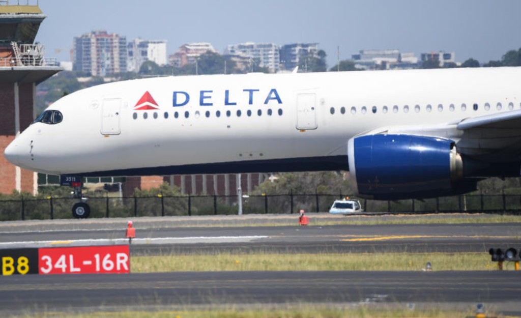 A Delta airline flight prepares to depart Sydney's Kingsford Smith airport on January 22, 2021 in Sydney, Australia. Prime Minister Scott Morrison has today confirmed after hosting the national cabinet meeting that international arrival caps on arriving passengers will remain in place. (Photo by James D. Morgan/Getty Images)