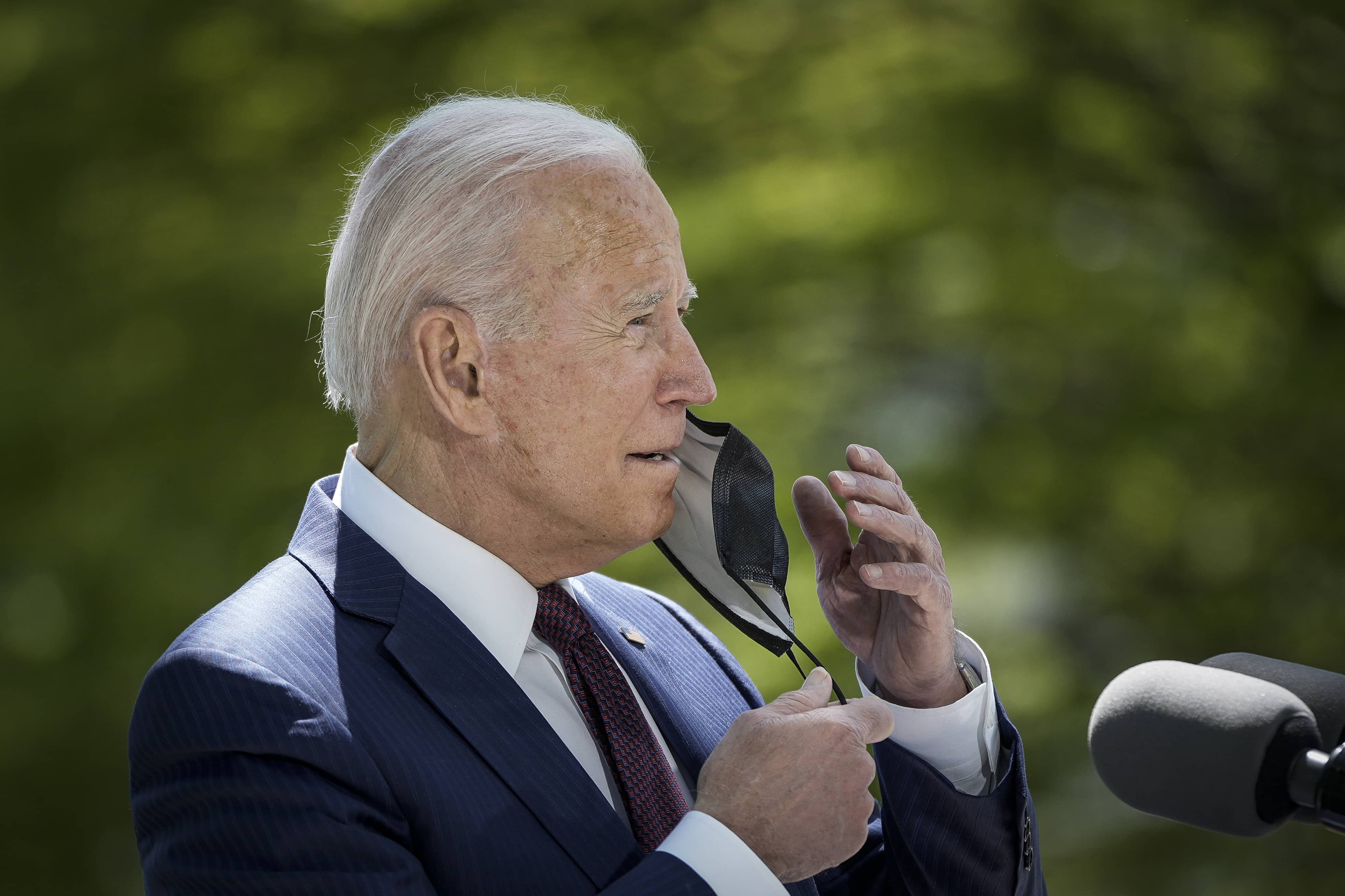 Biden outside taking mask off