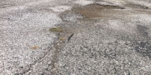 Pothole-damaged stretch of Forest Manor Avenue on Indy's northeast side