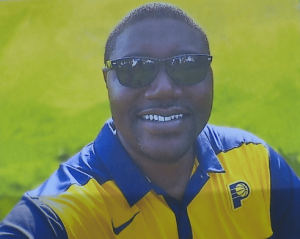 Chris Beaty wearing sunglasses and a Pacers polo
