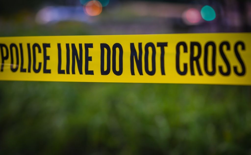 Current image: Police barrier tape at crime scene