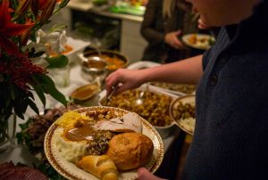 Unidentified diners serve themselves food at a traditional Thanksgiving Day family gathering in Bloomfield Hills, Michigan