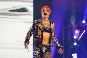 Photograph of AEW Superstar Ruby Soho, walking on stage, facing the crowd, making her entrance during an AEW event.