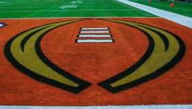 College Football Playoff logo on a football field