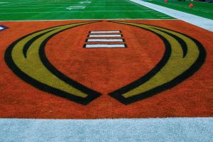 College Football Playoff logo on a football field
