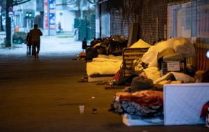Homeless people in Berlin, Germany, squat in cold temperatures under the bridge of the S-Bahn line near Stuttgarter Platz at Charlottenburg station.