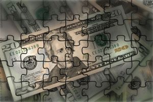 Graphic of a pile of $20 bills turned into a jigsaw puzzle