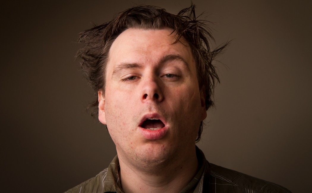 Man who just doesn't feel that awake and looks like he was sleeping at his desk.