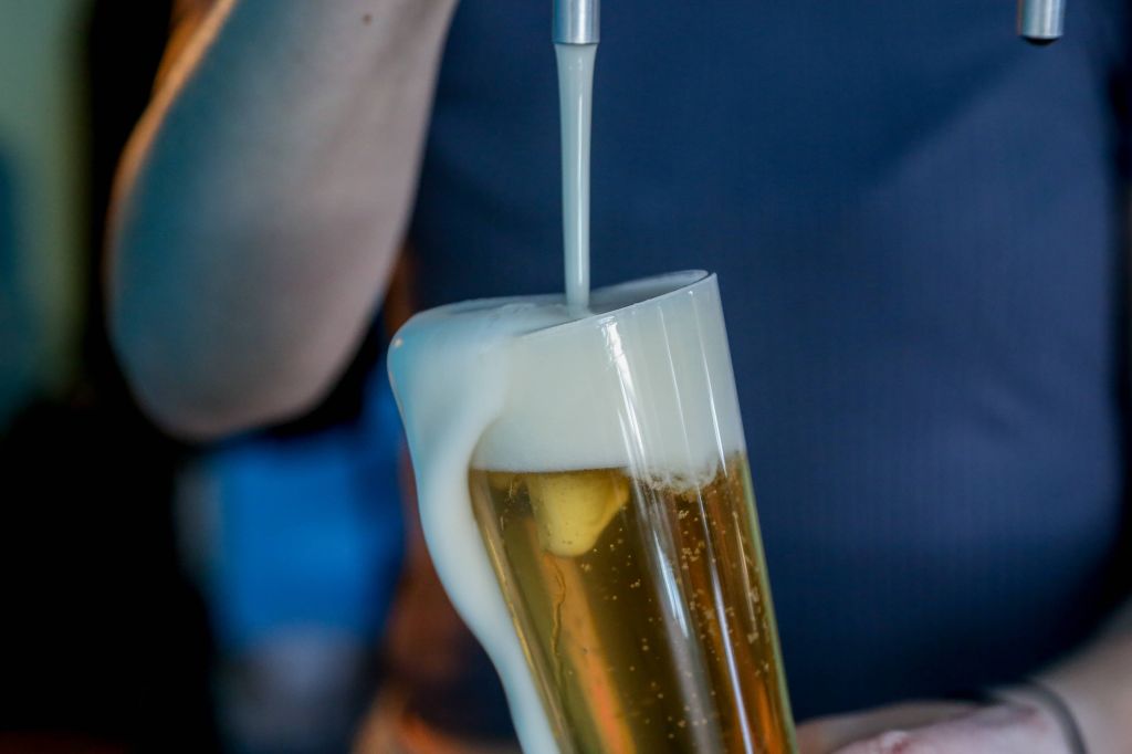 bartender serving craft beer