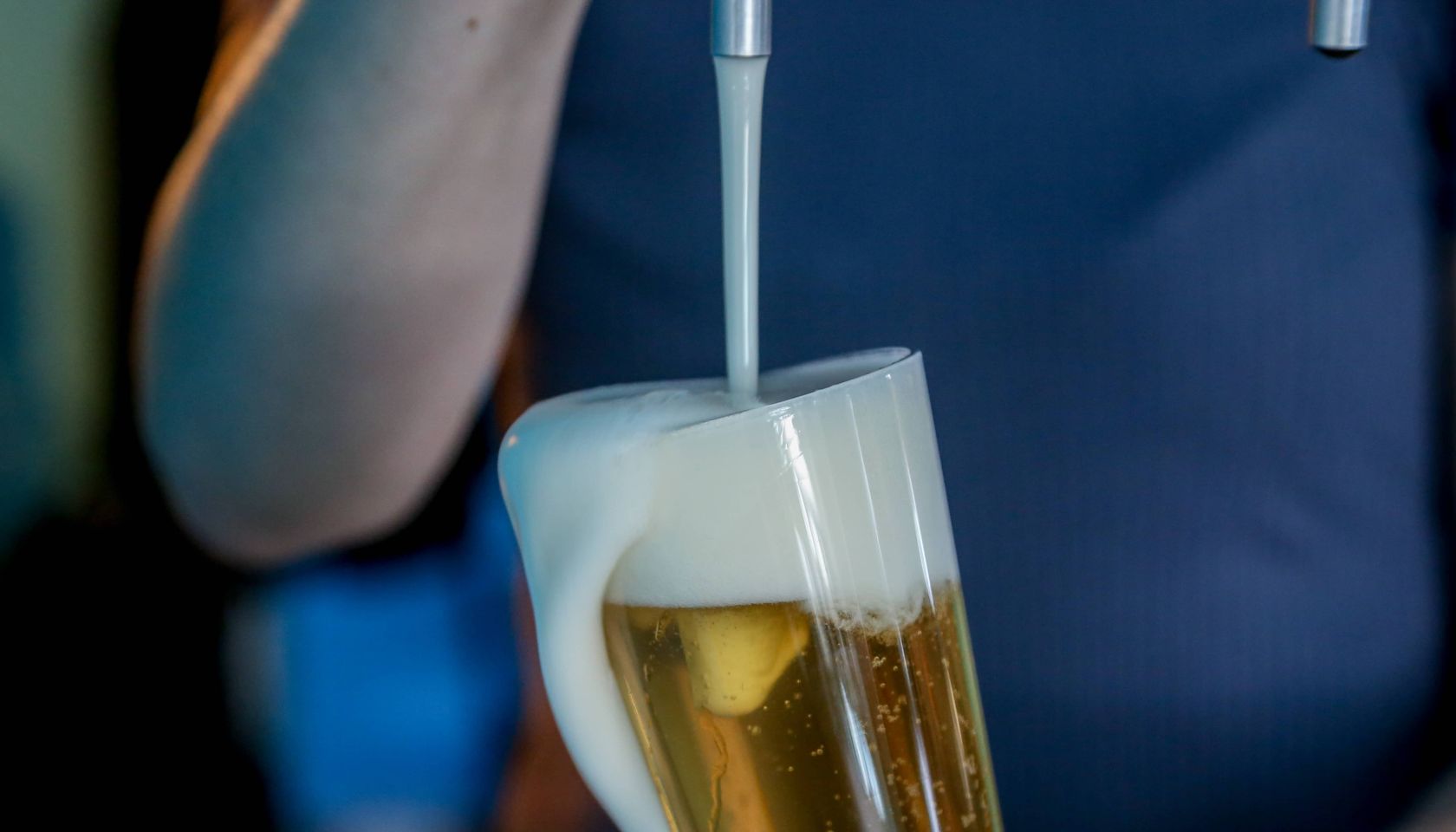 bartender serving craft beer