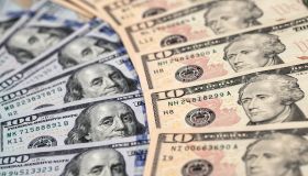 100 dollar bills spread out