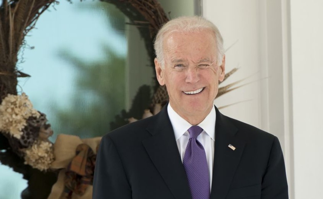 US Vice President Joe Biden reacts as reporters shout questions asking if he has made a decision on whether to run for President as he awaits the arrival of the South Korean President for lunch at the Naval Observatory in Washington, DC, October 15, 2015. AFP PHOTO / SAUL LOEB (Photo by Saul LOEB / AFP) (Photo by SAUL LOEB/AFP via Getty Images)