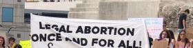 Protesters with signs that are pro abortion