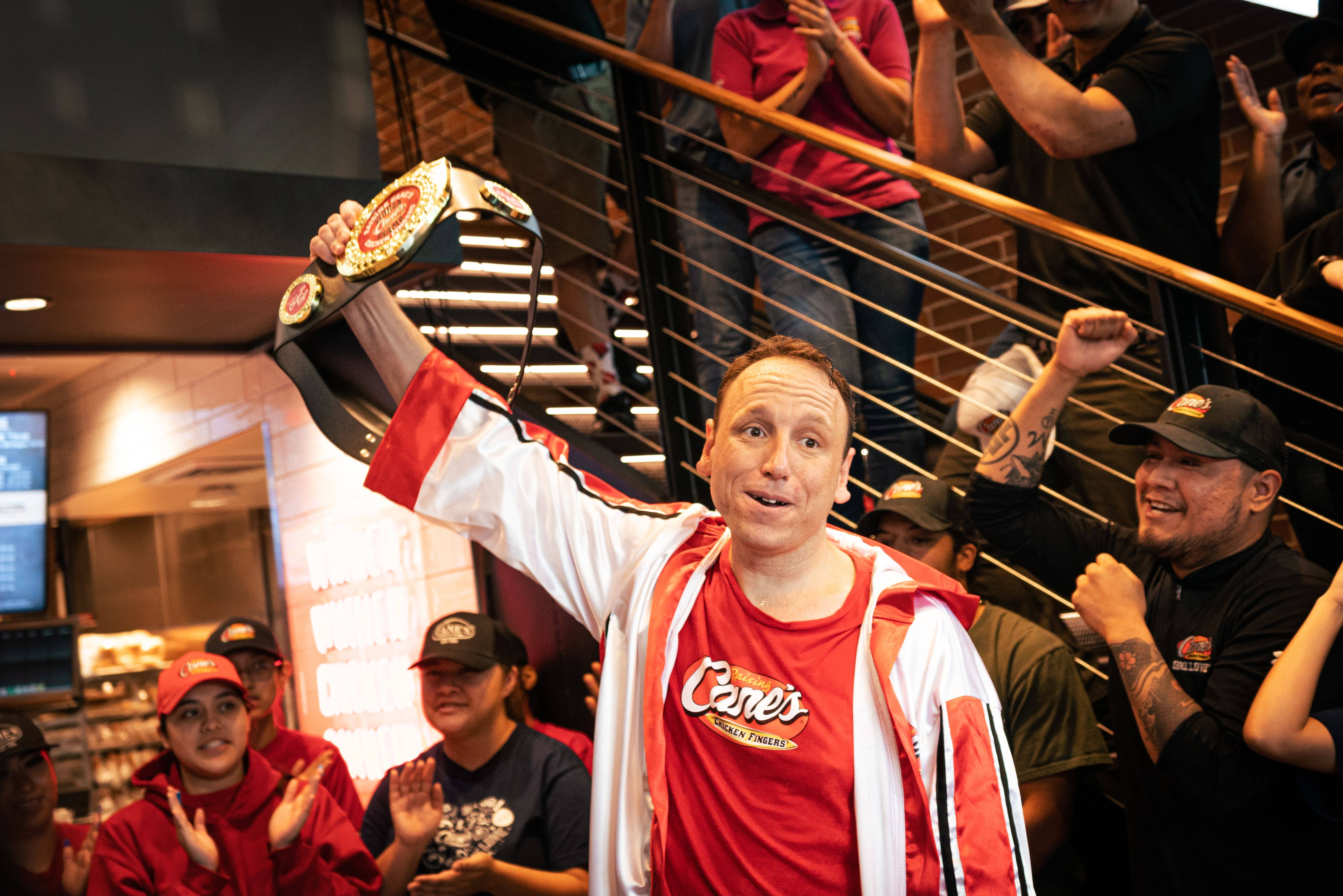 Joey Chestnut setting a record for eating chicken fingers