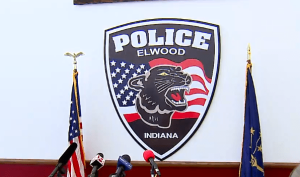 The Elwood Police Dept. patch behind a podium