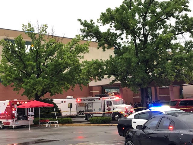 Emergency vehicles and people in front of the Greenwood Park Mall