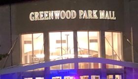 The facade at Greenwood Park Mall and police lights