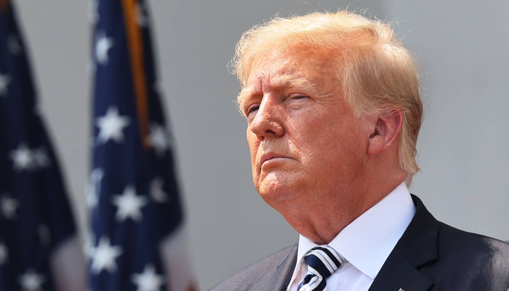U.S. President Donald Trump looks on during a press conference