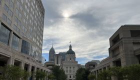 Landscape photo of Indiana's Statehouse, with each government center on opposing sides.