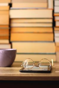 Cup, Books, E-Reader and Glasses