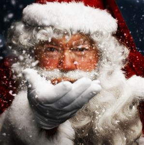 Father Christmas blowing snow, portrait, close-up