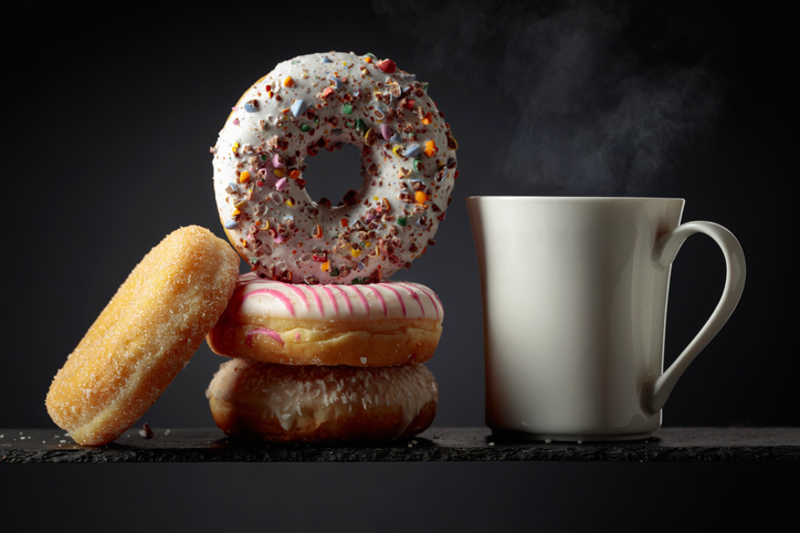 Sweet delicious tasty donuts and a white mug.