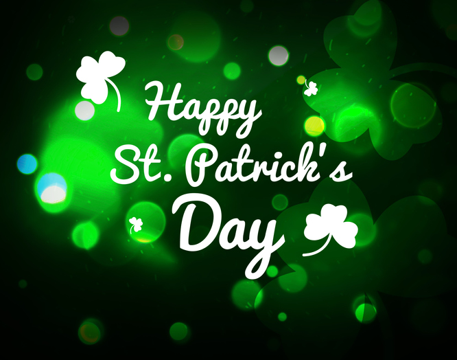 Happy St. Patrick's Day bokeh background with colorful green flowers and lights. Modern Saint Patrick's Day backdrop