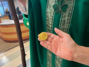 Image of Gold Coin Next to Chaplain Kevin Caspersen at ASVHC