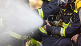 Firefighter team spay water to fire.