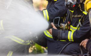 Firefighter team spay water to fire.