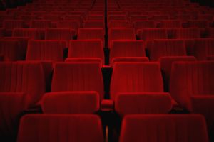 Beautiful view of empty red theater seats- perfect for background and wallpaper use