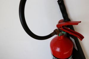 A fire extinguisher is an active fire protection device used to extinguish or control small fires