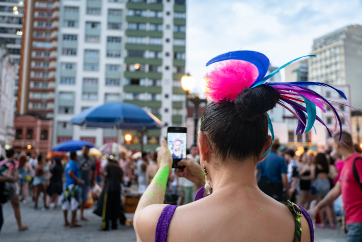 Woman dressed for carnival taking a selfie