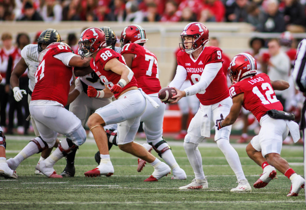 Indiana Hoosiers quarterback Connor Bazelak (9) hands the...