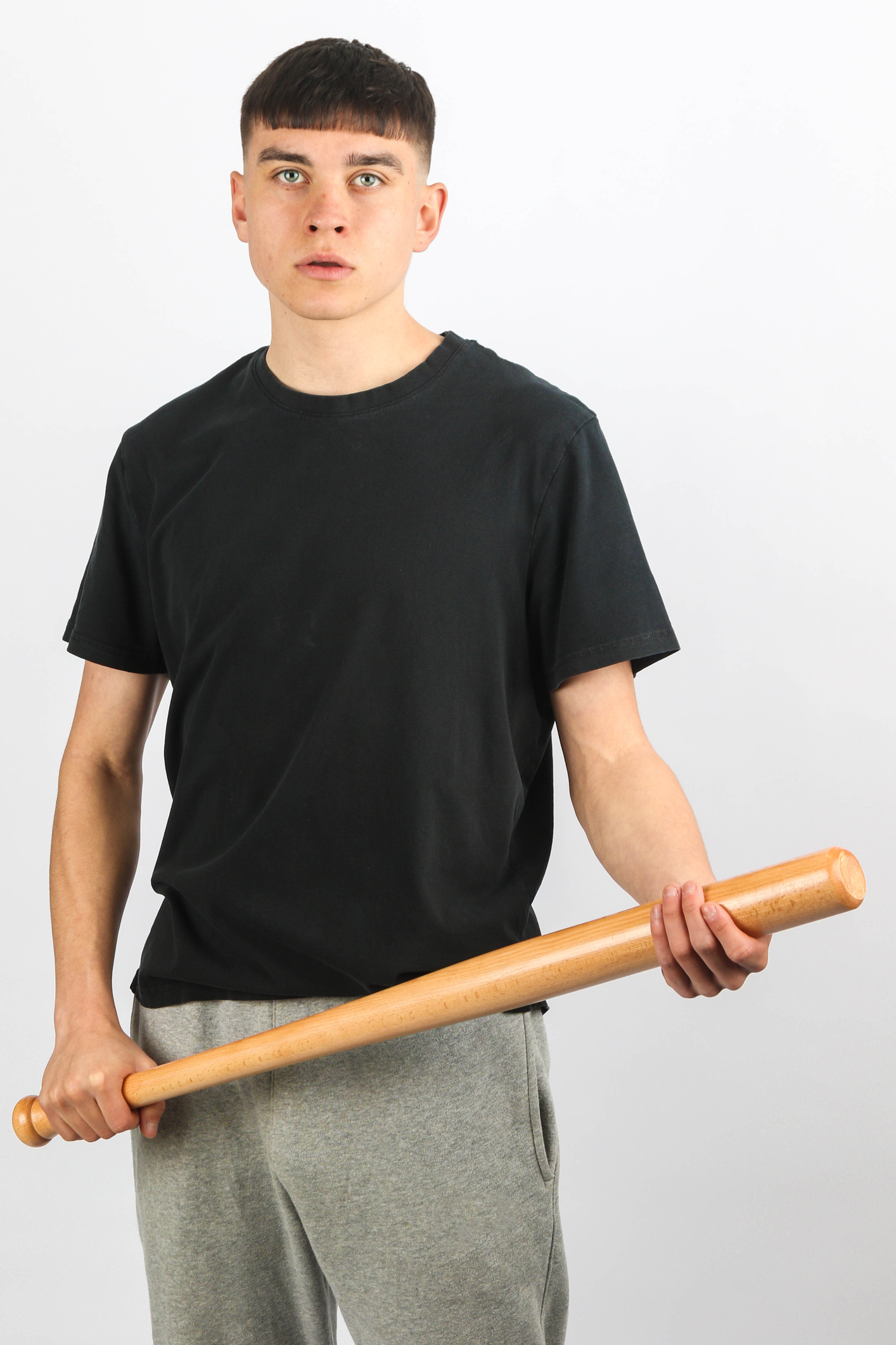 Teen boy baseball bat white background