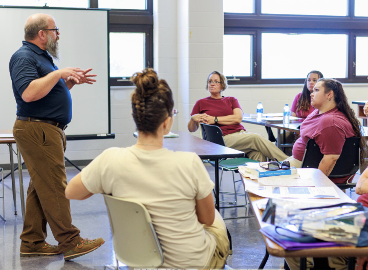 Teacher at Marian speaking to inmates