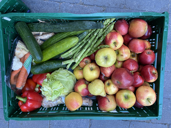 Give away fruits and vegetables from the food rescue