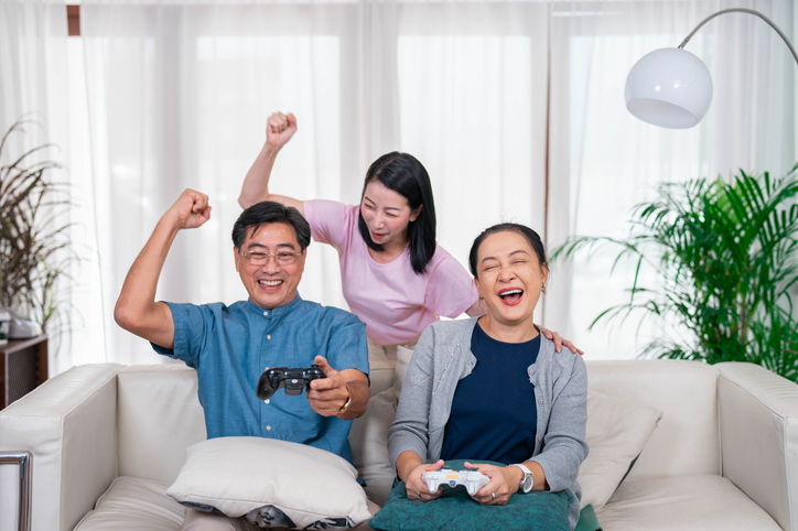 Family having fun with playing game in their house