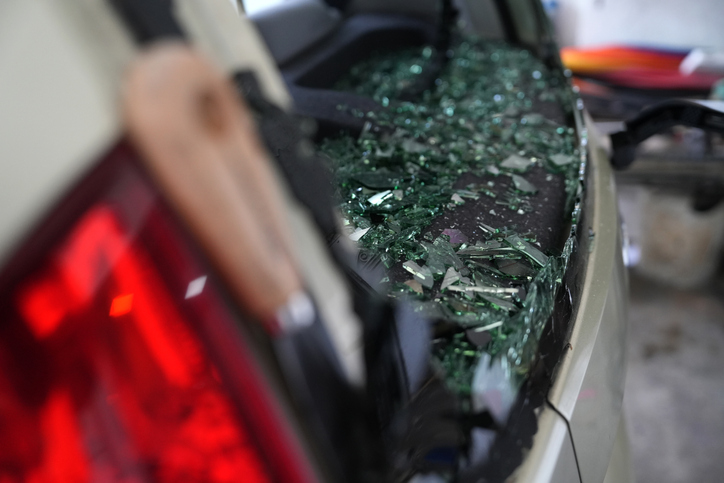 Shards of broken glass rear windshied of a car