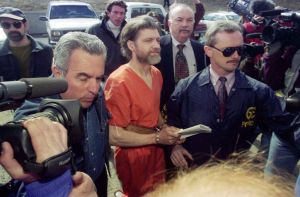 Theodore "Ted" Kaczynski is guided to his arraignment by federal marshals in Helena, Montana on April 4, 1996, following his arrest in connection with the infamous "Unabomber" bombings and the deaths those explosions caused.